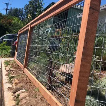 Wooden and wire garden fence